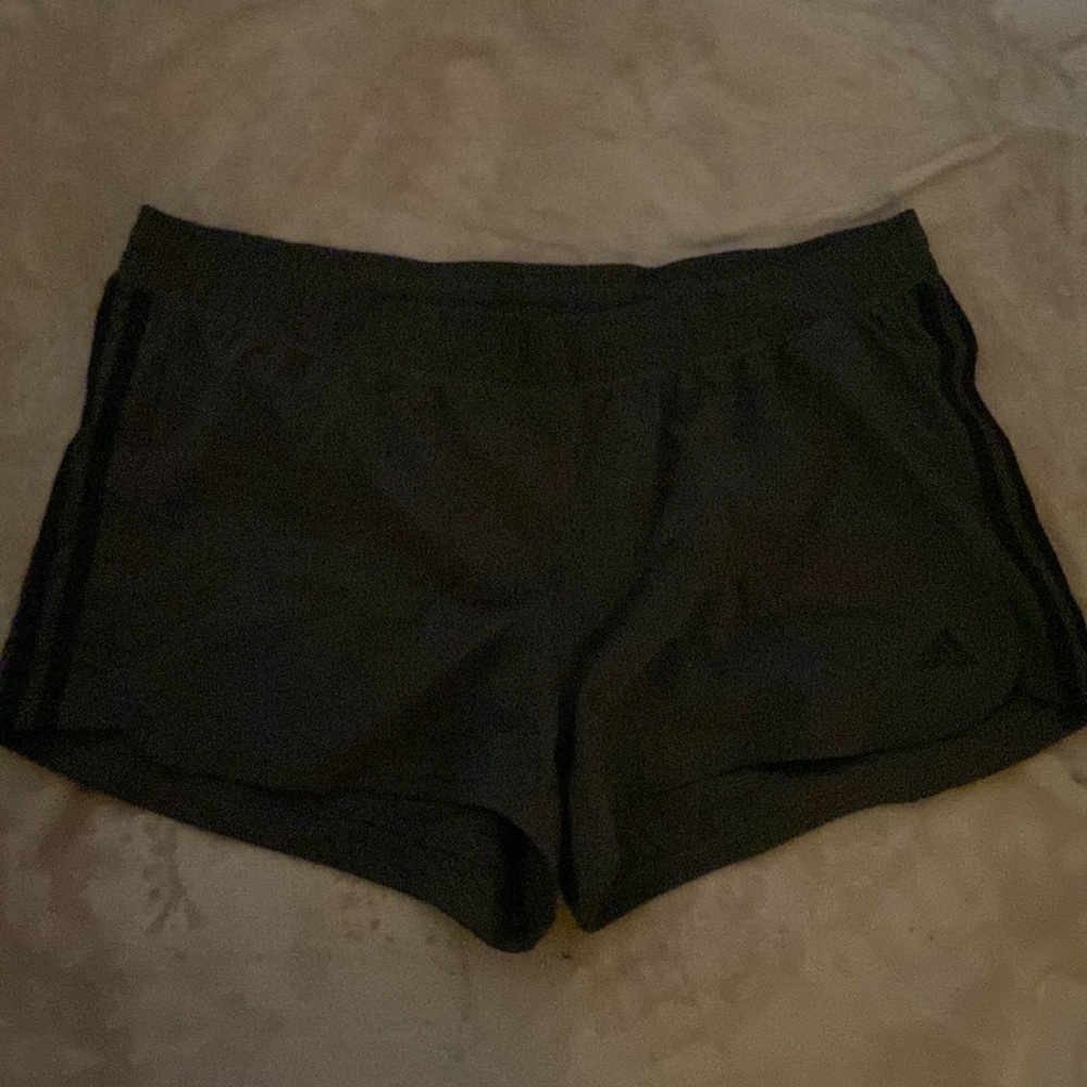 Gray adidas shorts.